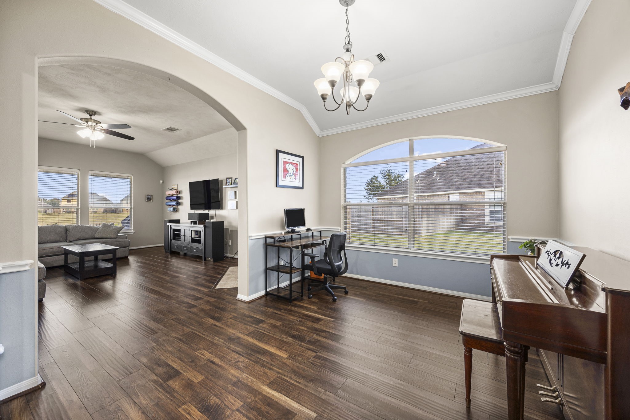 2202 Winchester Lake Rosenberg, TX 77471 - Photo 8 of 31 Formal dining room and living area have recent engineered wood floors, high ceilings and banks of windows for abundant natural light.