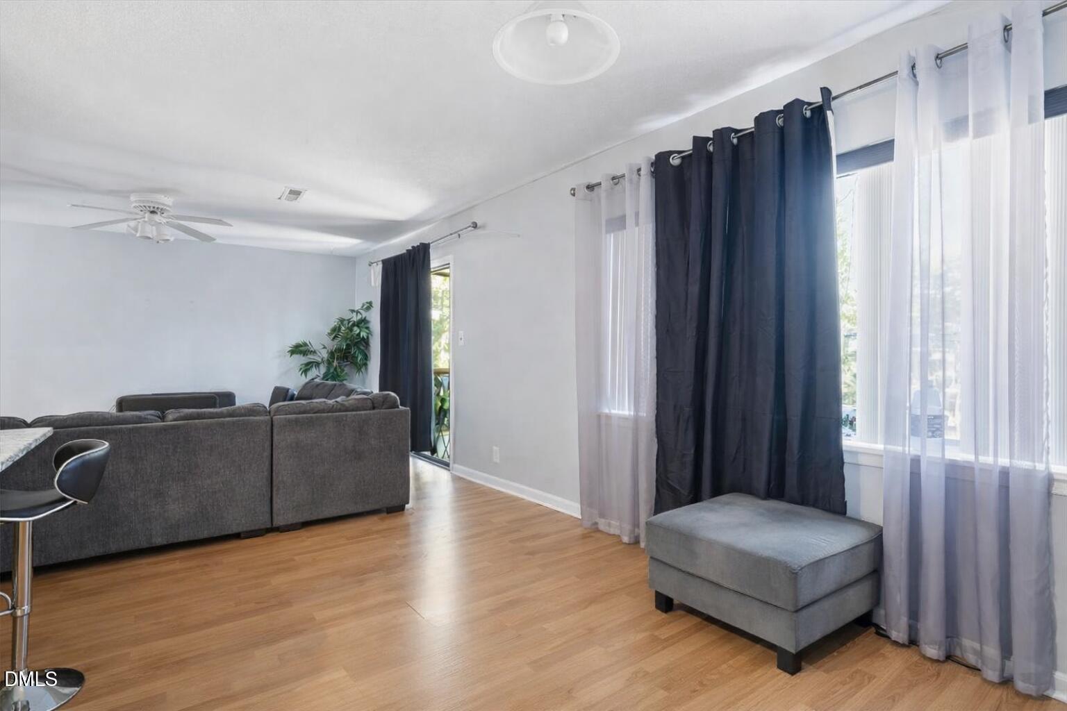 5130 Flint Ridge Place Raleigh, NC 27609 - Photo 12 of 22 a living room with furniture and a window