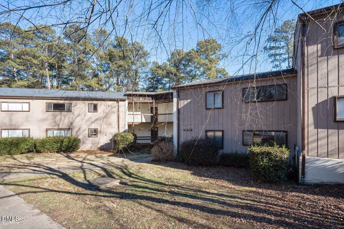 5130 Flint Ridge Place Raleigh, NC 27609 - Photo 2 of 22 a front view of a house with a yard