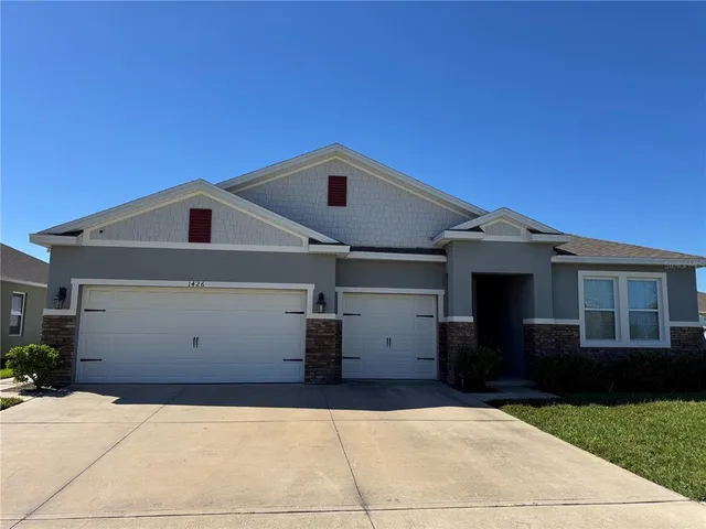 a front view of a house with a garage