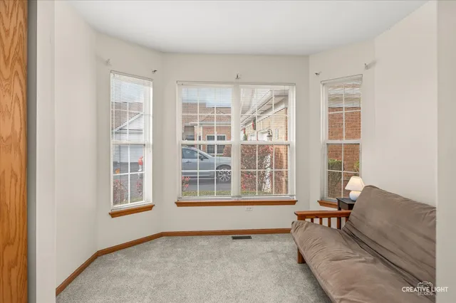 a living room with furniture and windows