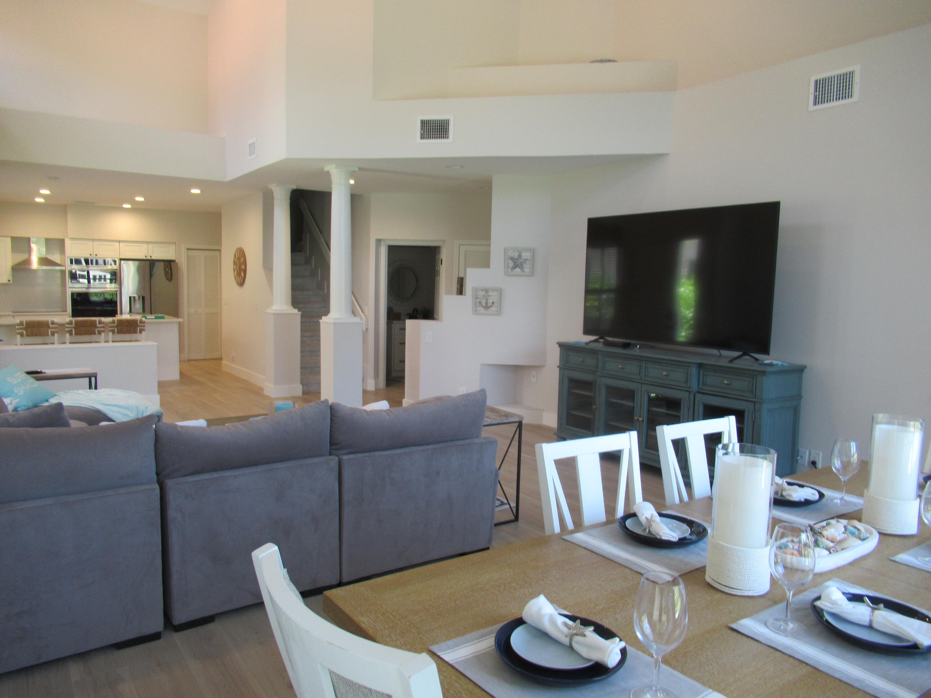 2237 Northwest 53rd Street Boca Raton, FL 33496 - Photo 11 of 76 a living room with furniture and a flat screen tv