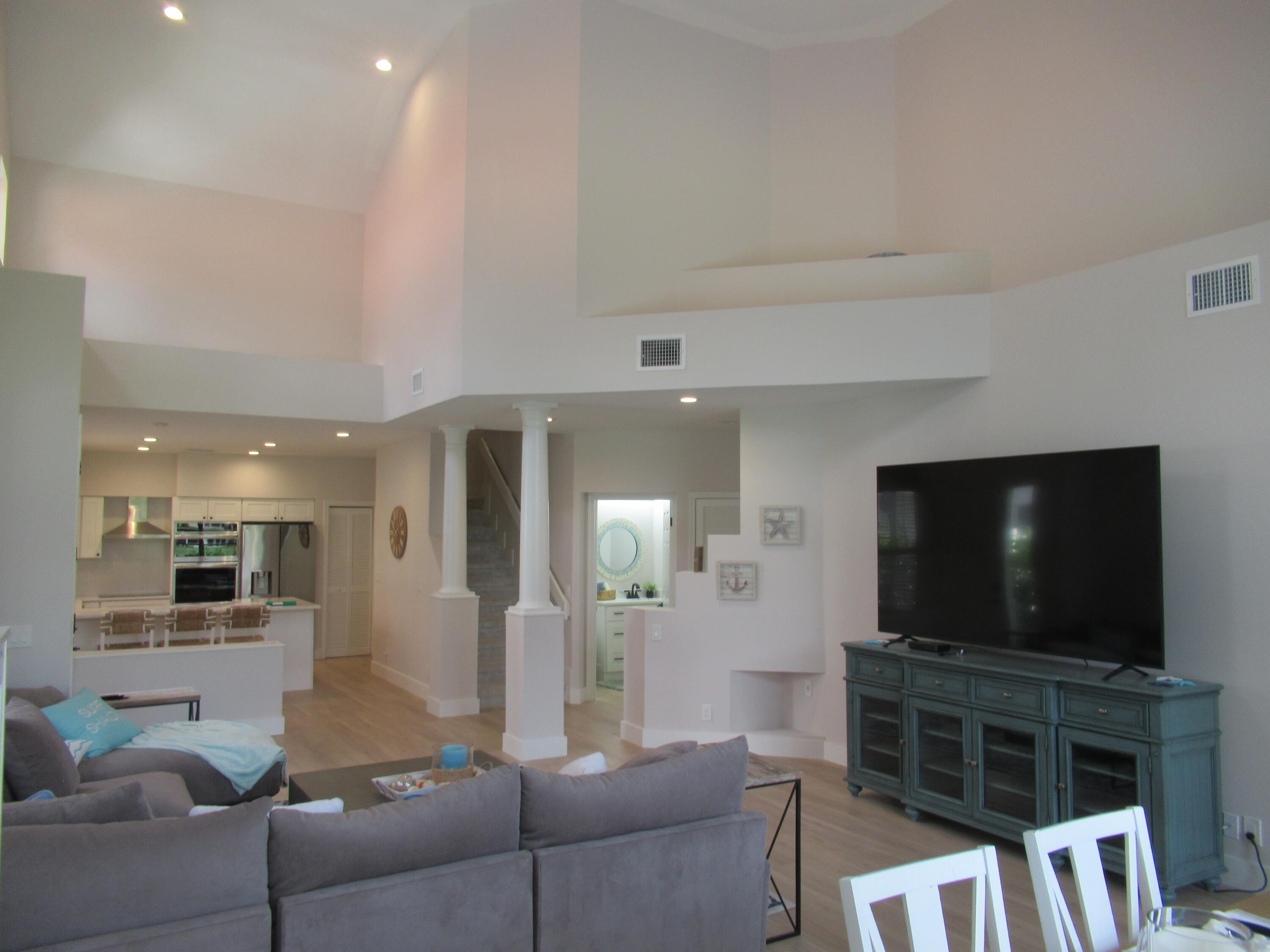 2237 Northwest 53rd Street Boca Raton, FL 33496 - Photo 13 of 76 a living room with furniture and a flat screen tv