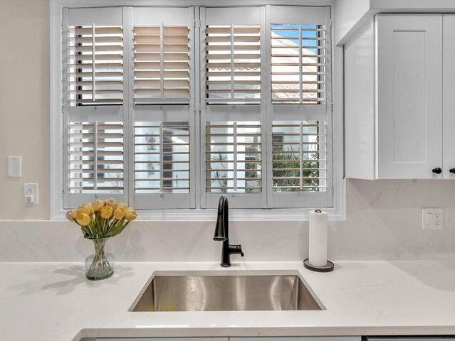 2237 Northwest 53rd Street Boca Raton, FL 33496 - Photo 17 of 76 a bathroom with a sink and a window