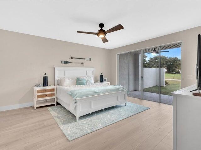 2237 Northwest 53rd Street Boca Raton, FL 33496 - Photo 24 of 76 a bedroom with a bed and window