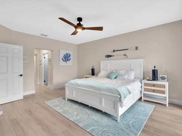 2237 Northwest 53rd Street Boca Raton, FL 33496 - Photo 25 of 76 a bedroom with a large bed and white walls