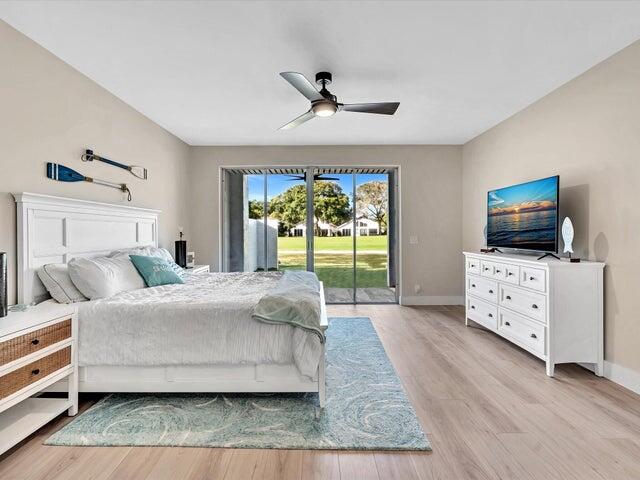2237 Northwest 53rd Street Boca Raton, FL 33496 - Photo 27 of 76 a living room with furniture and a flat screen tv