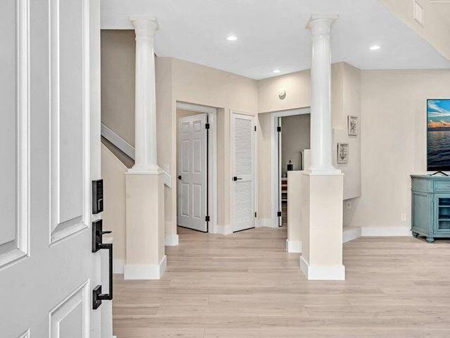 2237 Northwest 53rd Street Boca Raton, FL 33496 - Photo 3 of 76 a view of a hallway with wooden floor and entryway