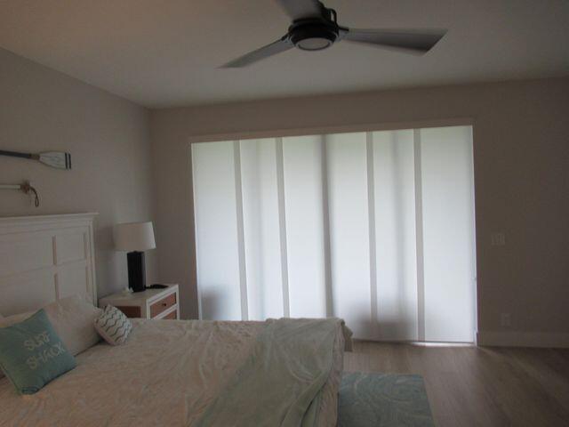 2237 Northwest 53rd Street Boca Raton, FL 33496 - Photo 39 of 76 a bedroom with a bed and a window