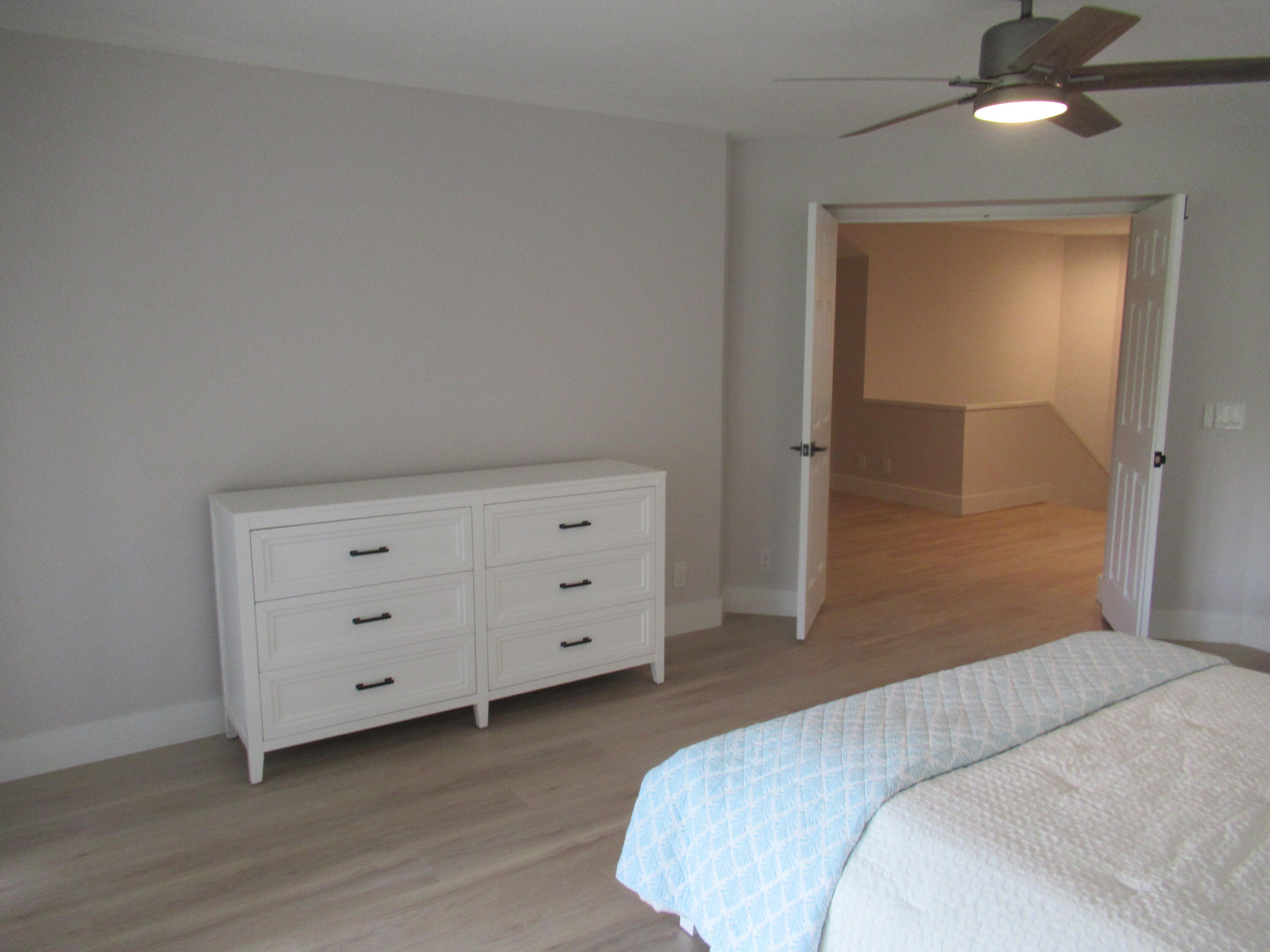 2237 Northwest 53rd Street Boca Raton, FL 33496 - Photo 40 of 76 a bedroom with a bed and a dresser