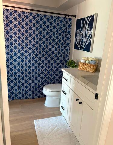 2237 Northwest 53rd Street Boca Raton, FL 33496 - Photo 43 of 76 a bathroom with a toilet and a shower curtain