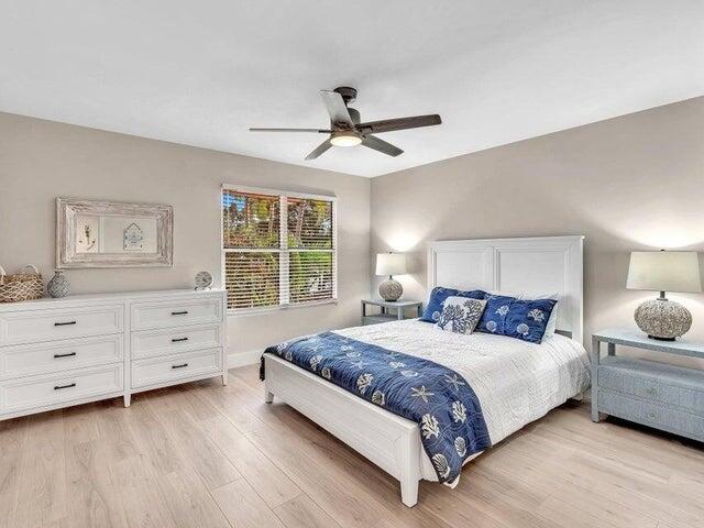 2237 Northwest 53rd Street Boca Raton, FL 33496 - Photo 47 of 76 a bedroom with a bed and a dresser