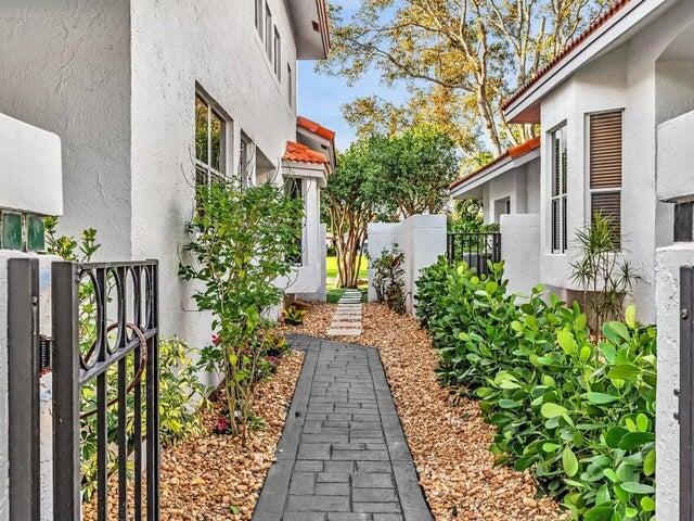 2237 Northwest 53rd Street Boca Raton, FL 33496 - Photo 53 of 76 a view of a pathway with house on both side