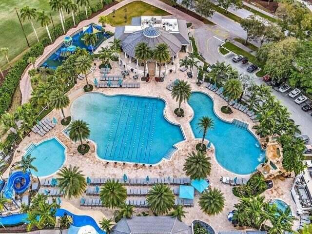 2237 Northwest 53rd Street Boca Raton, FL 33496 - Photo 68 of 76 an aerial view of a house yard and swimming pool