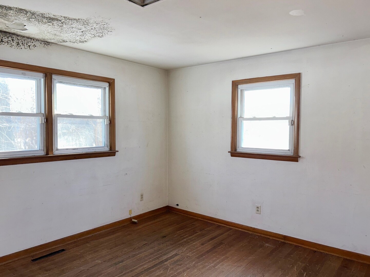 44 Strasma W Drive Kankakee, IL 60901 - Photo 11 of 20 a view of an empty room with wooden floor and a window