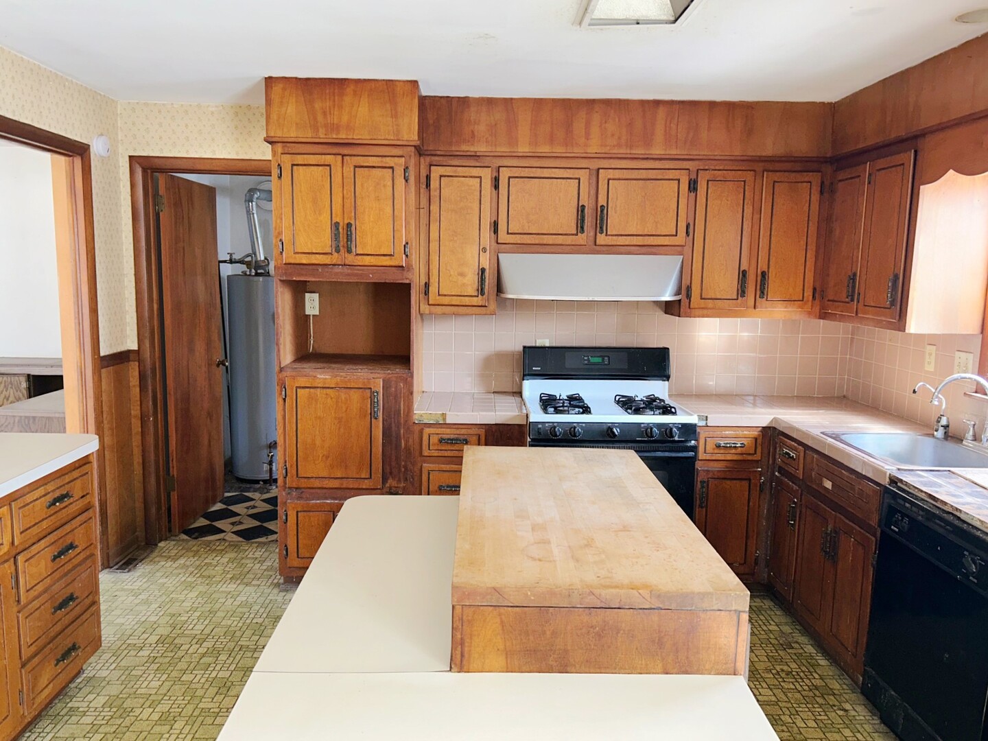 44 Strasma W Drive Kankakee, IL 60901 - Photo 17 of 20 a kitchen with kitchen island granite countertop a stove top oven microwave and cabinets