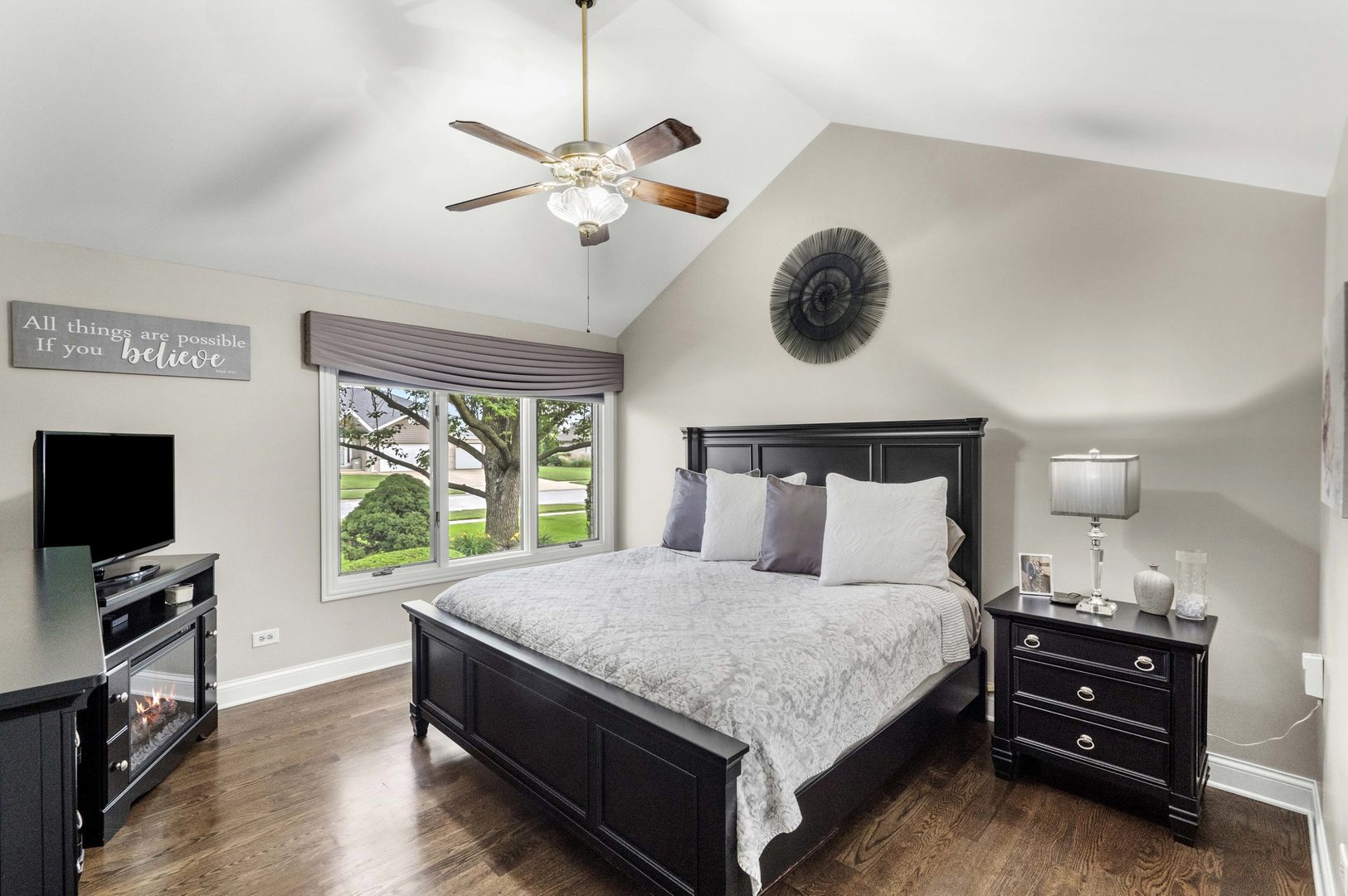 322 Orchard Lane Beecher, IL 60401 - Photo 14 of 38 a bedroom with a bed and a flat tv screen on a dresser