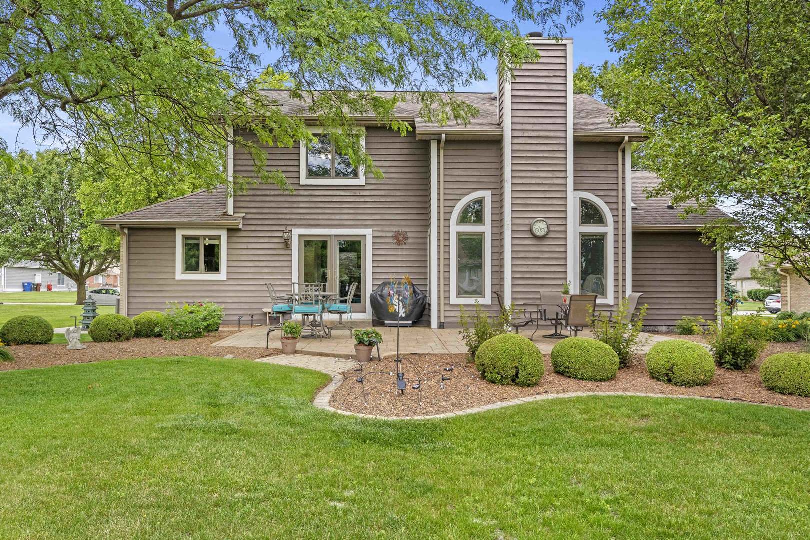 322 Orchard Lane Beecher, IL 60401 - Photo 25 of 38 a front view of house with a garden and patio