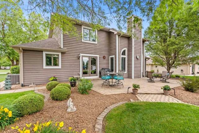 a view of a backyard with sitting area