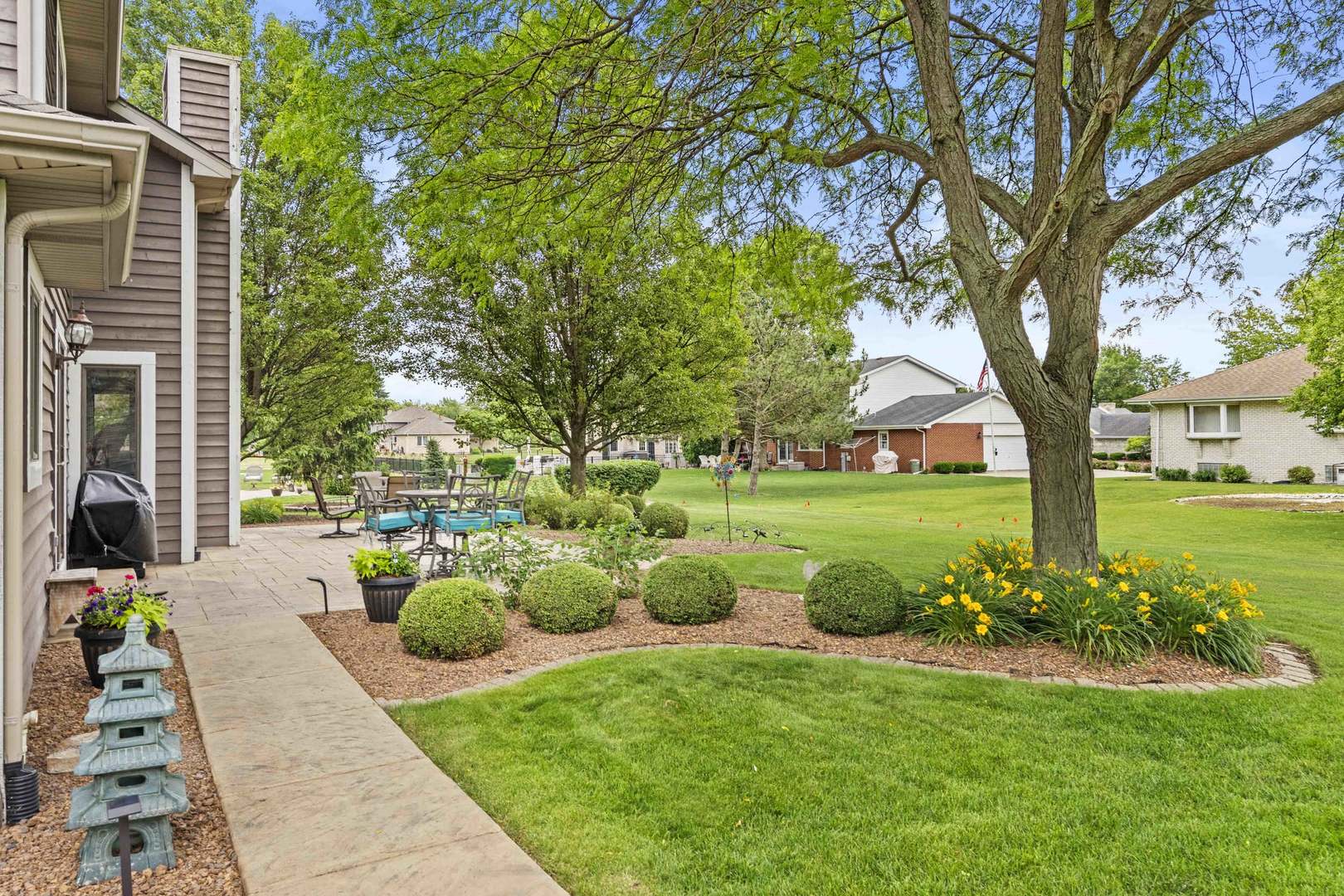 322 Orchard Lane Beecher, IL 60401 - Photo 28 of 38 a view of a garden with patio