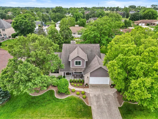 a view of a garden with a building in the background