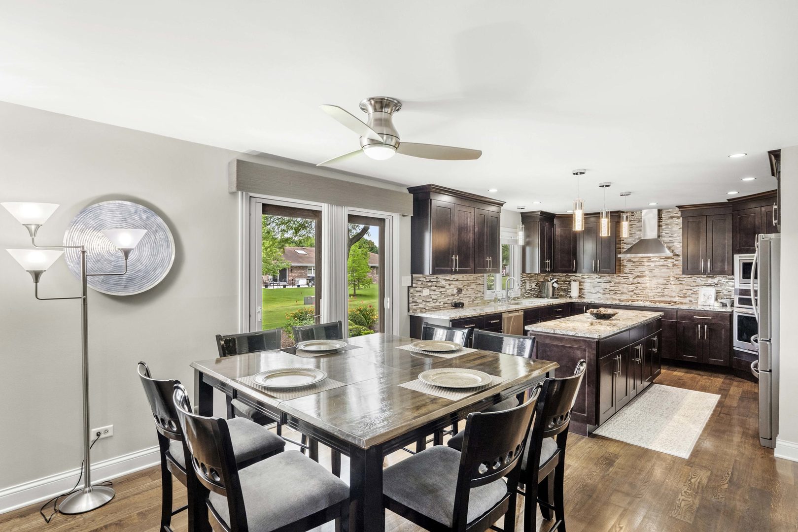322 Orchard Lane Beecher, IL 60401 - Photo 9 of 38 a view of a dining room with furniture window and wooden floor