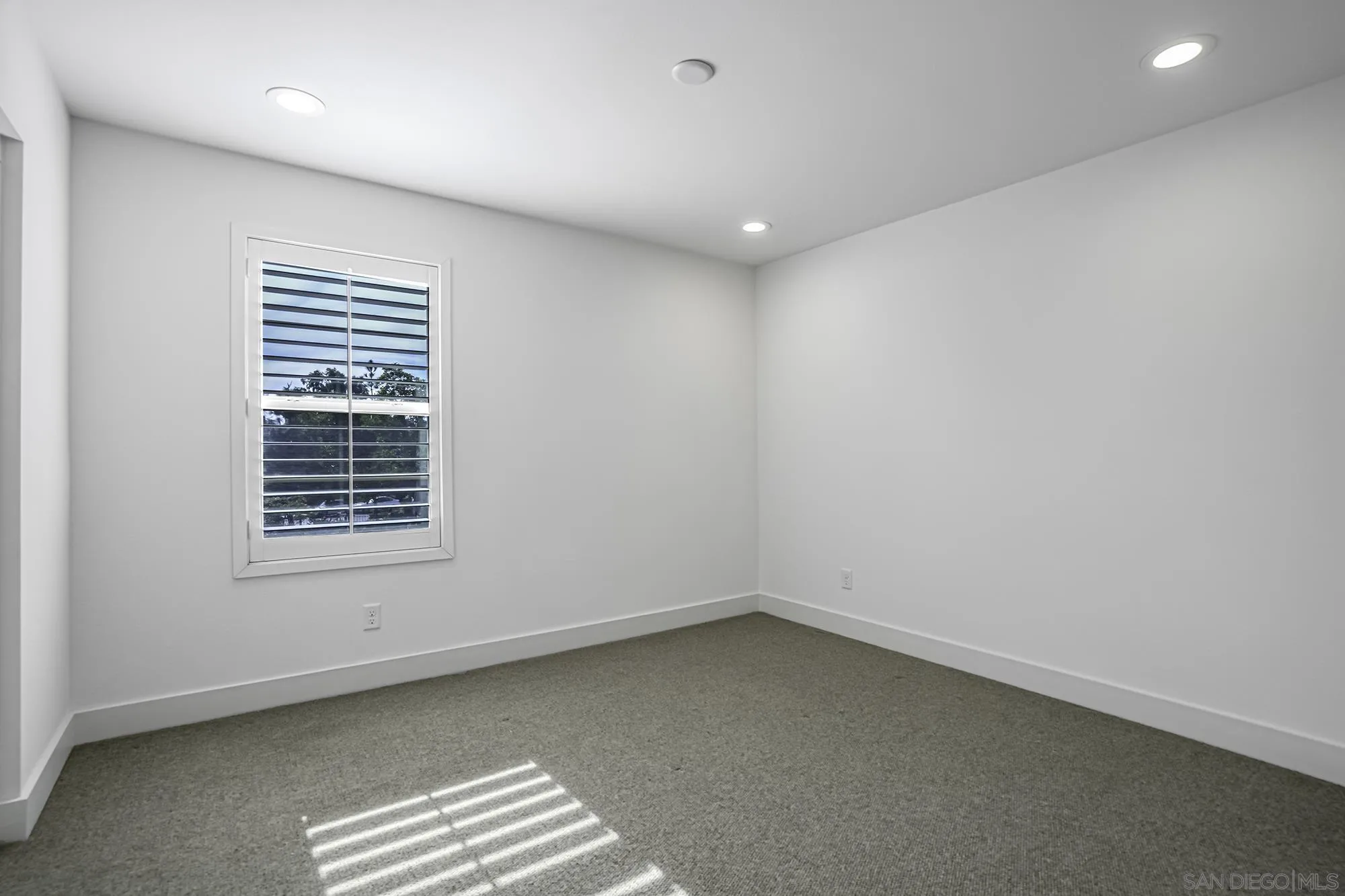 145 Stonesteps Way Encinitas, CA 92024 - Photo 11 of 25 an empty room with a window