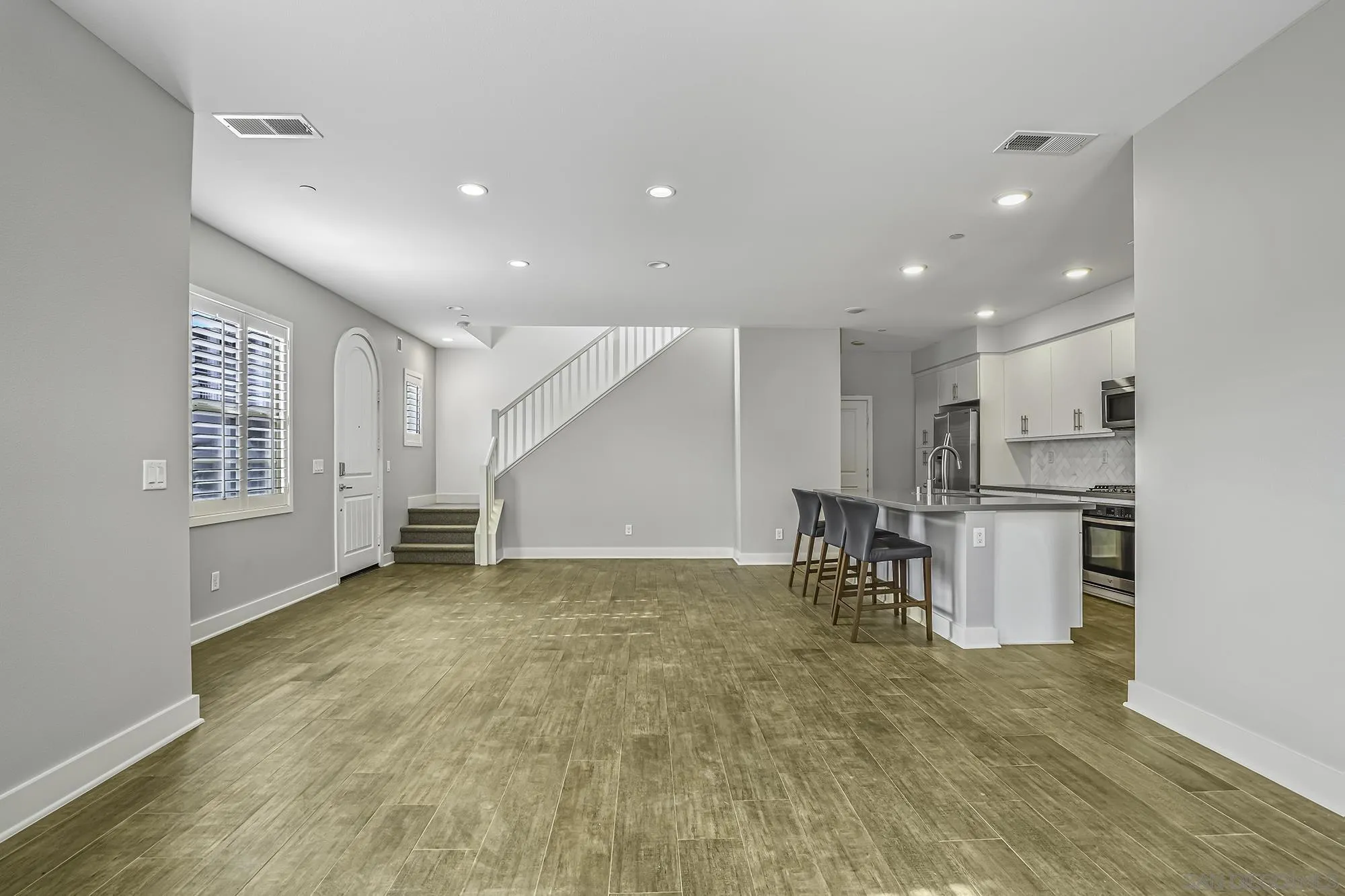 145 Stonesteps Way Encinitas, CA 92024 - Photo 4 of 25 a view of kitchen with furniture and refrigerator
