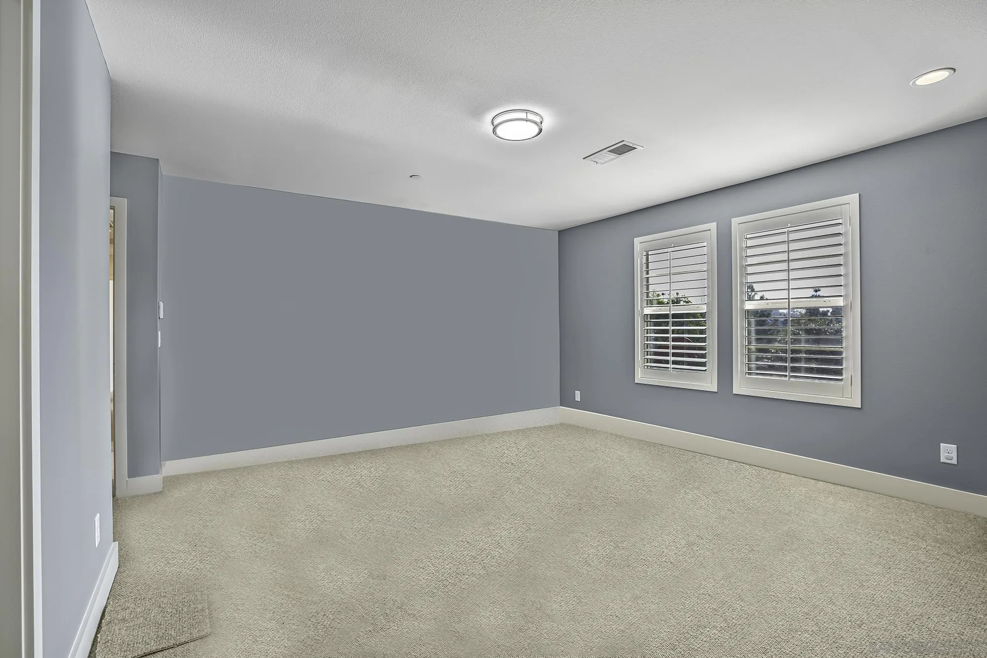 145 Stonesteps Way Encinitas, CA 92024 - Photo 8 of 25 a view of an empty room with a window