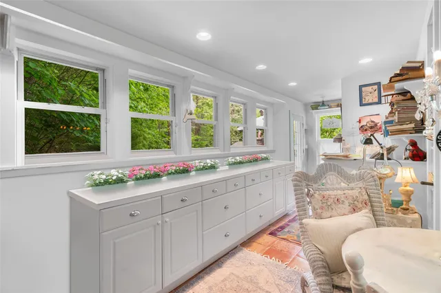 a view of a dining room with furniture window and outside view