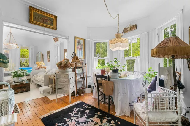 a bedroom with a bed a lamp and a window