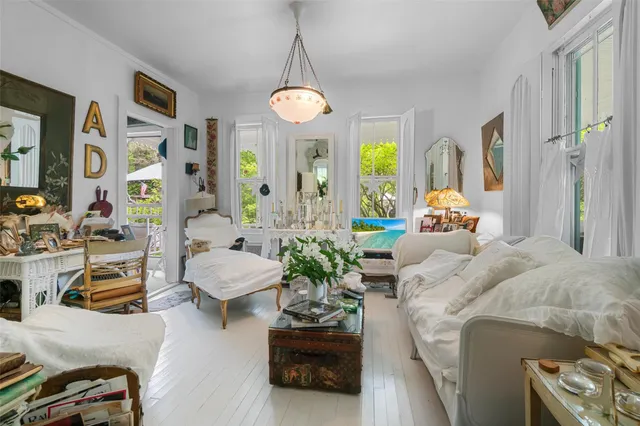 a bedroom with a bed and chandelier