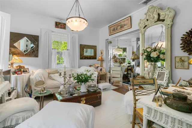 a view of a backyard with a bench and trees