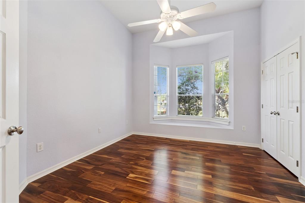 2125 Kane Park Way Windermere, FL 34786 - Photo 33 of 63 a view of an empty room with wooden floor and a window