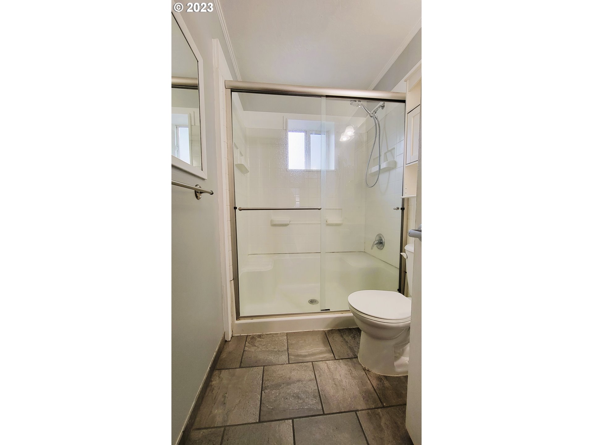 582 36th Street Springfield, OR 97478 - Photo 11 of 16 a bathroom with a toilet and a shower