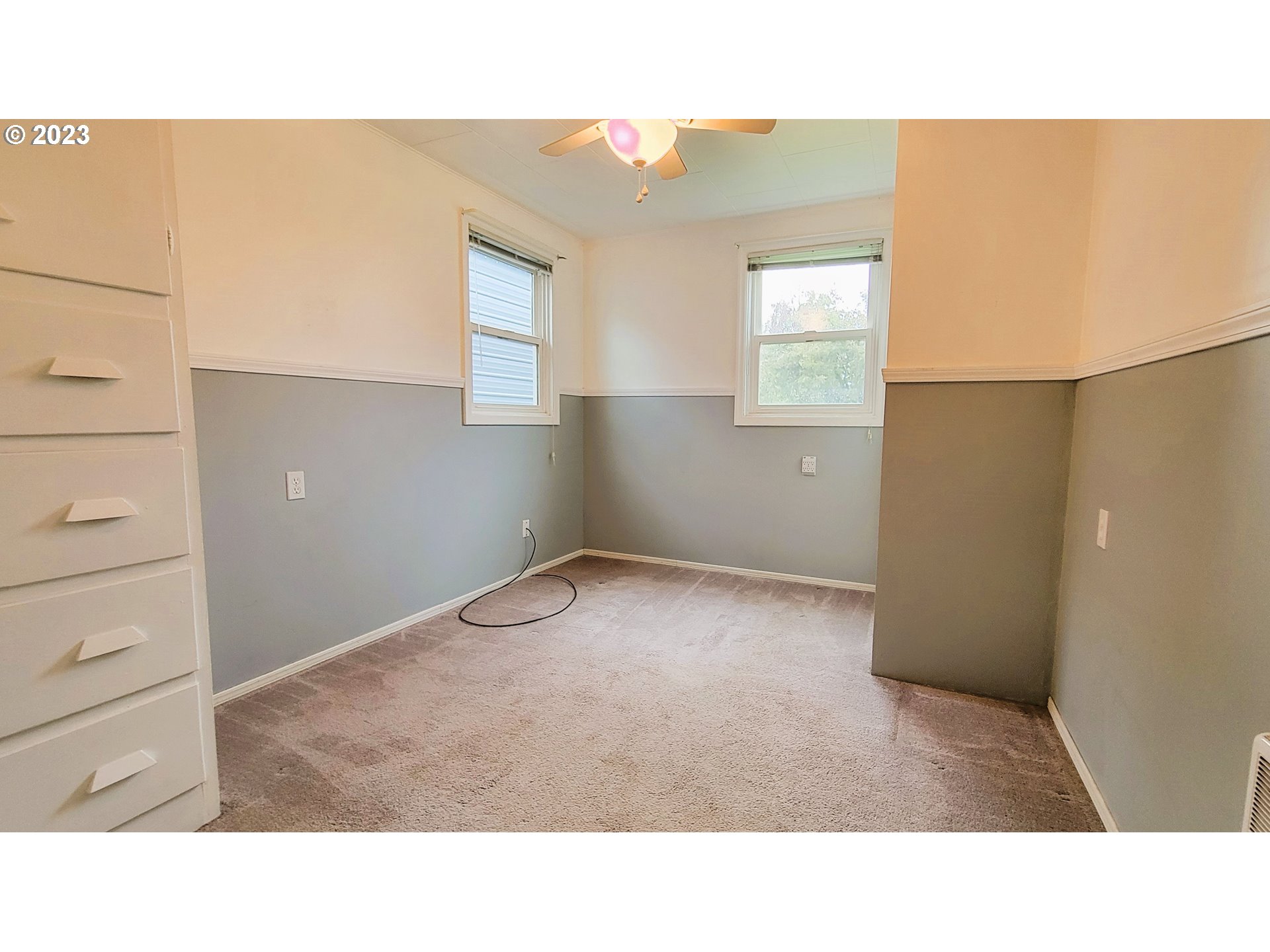 582 36th Street Springfield, OR 97478 - Photo 12 of 16 a open hall with a painting on the wall
