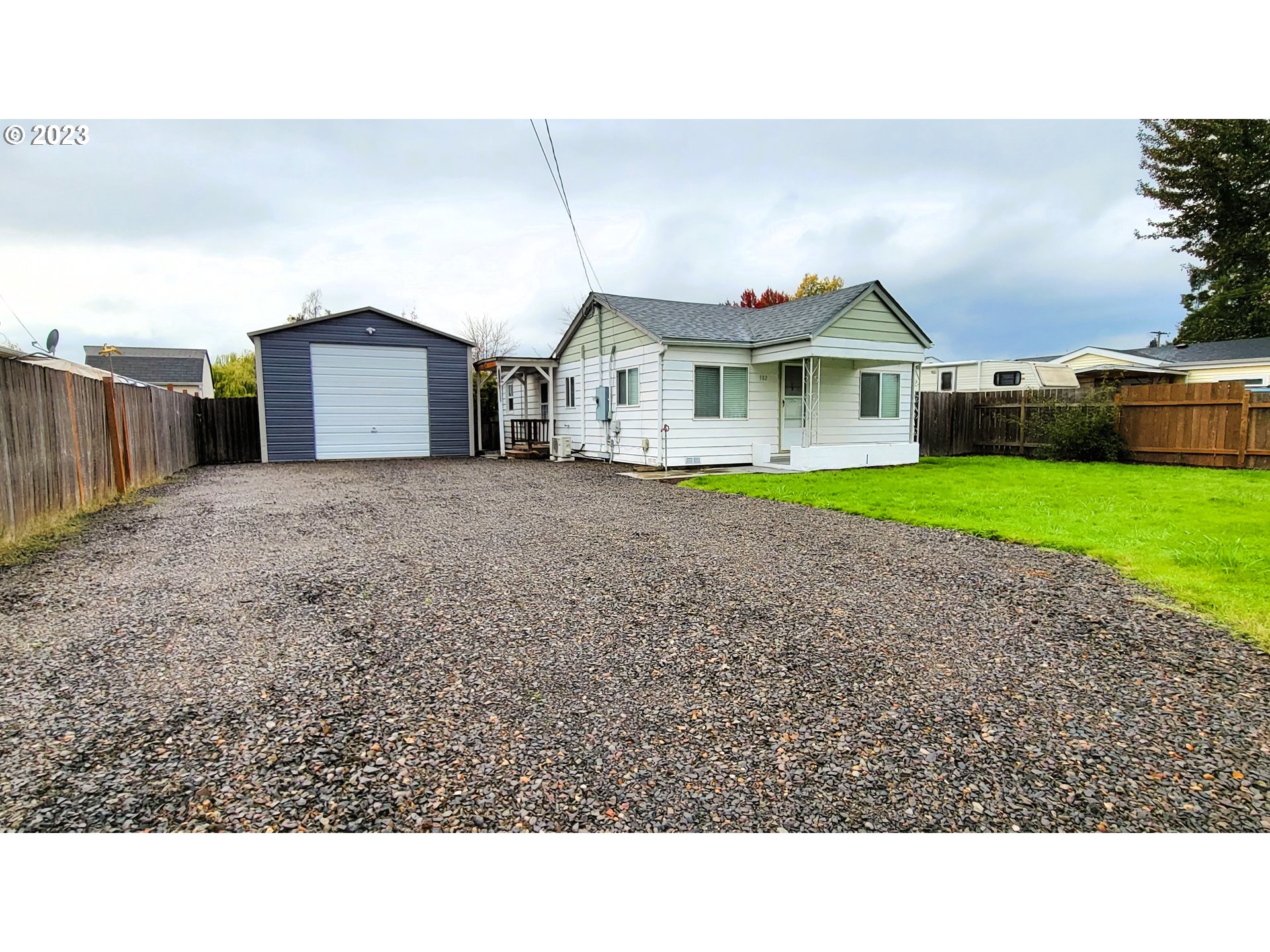 582 36th Street Springfield, OR 97478 - Photo 2 of 16 a black and white house with a yard