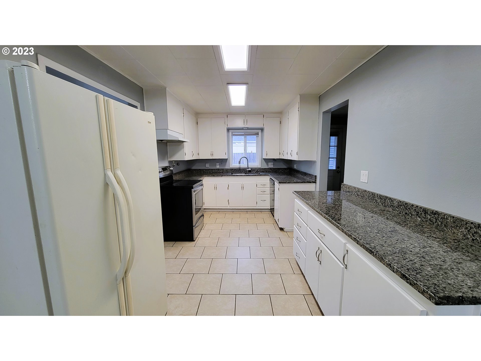 582 36th Street Springfield, OR 97478 - Photo 6 of 16 a open kitchen with a sink and refrigerator