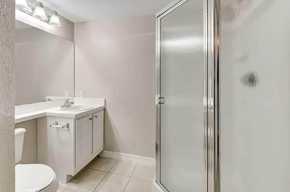 15155 Michelangelo Boulevard, Unit 306 Delray Beach, FL 33446 - Photo 17 of 32 a bathroom with a sink vanity and a mirror