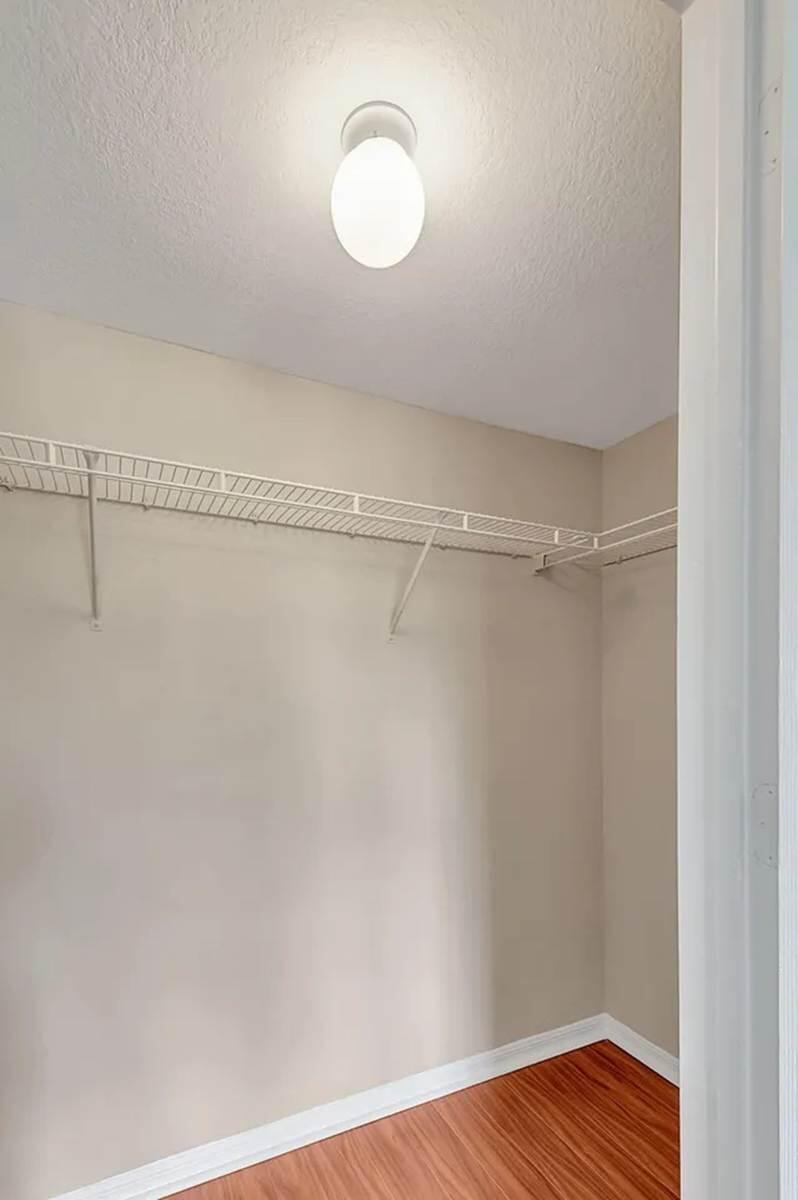 15155 Michelangelo Boulevard, Unit 306 Delray Beach, FL 33446 - Photo 18 of 32 a view of a room with wooden floor