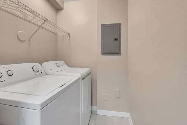 a kitchen with a sink a stove and cabinets
