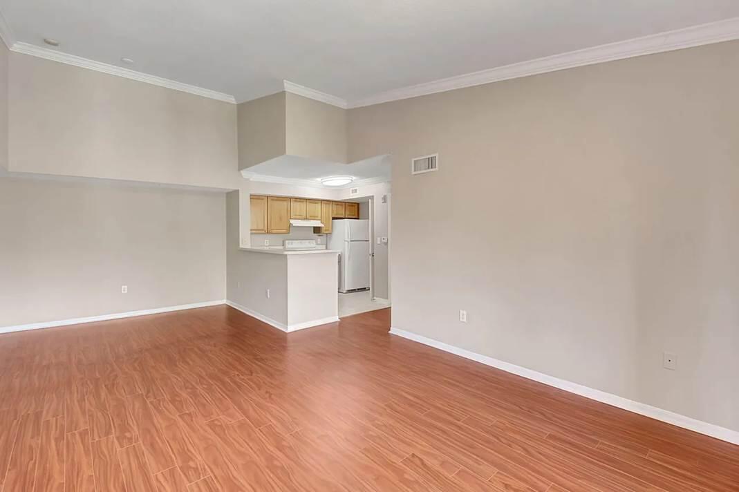 15155 Michelangelo Boulevard, Unit 306 Delray Beach, FL 33446 - Photo 26 of 32 a view of a kitchen with wooden floor and a kitchen