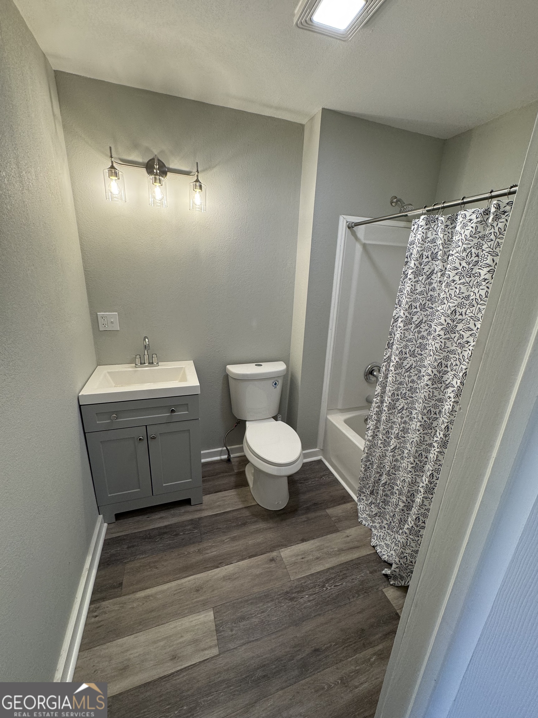 37 West Church Street Elberton, GA 30635 - Photo 21 of 37 a bathroom with a sink toilet and shower