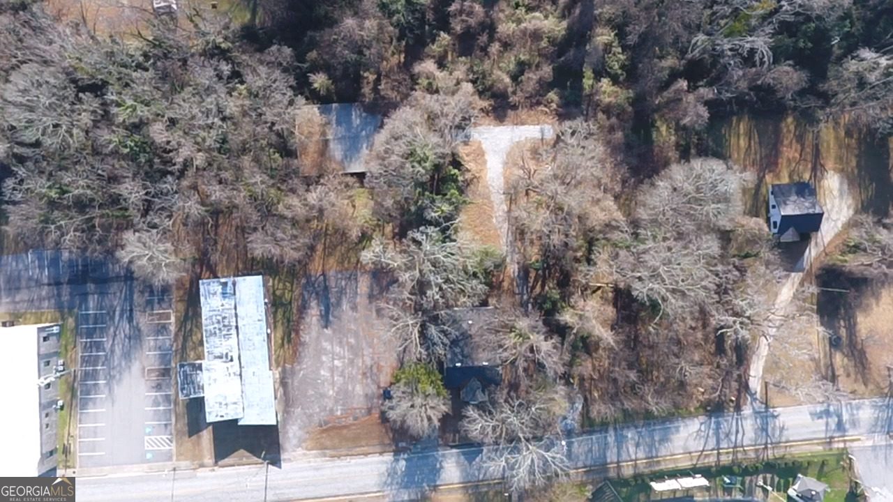 37 West Church Street Elberton, GA 30635 - Photo 29 of 37 a backyard of a building with large trees