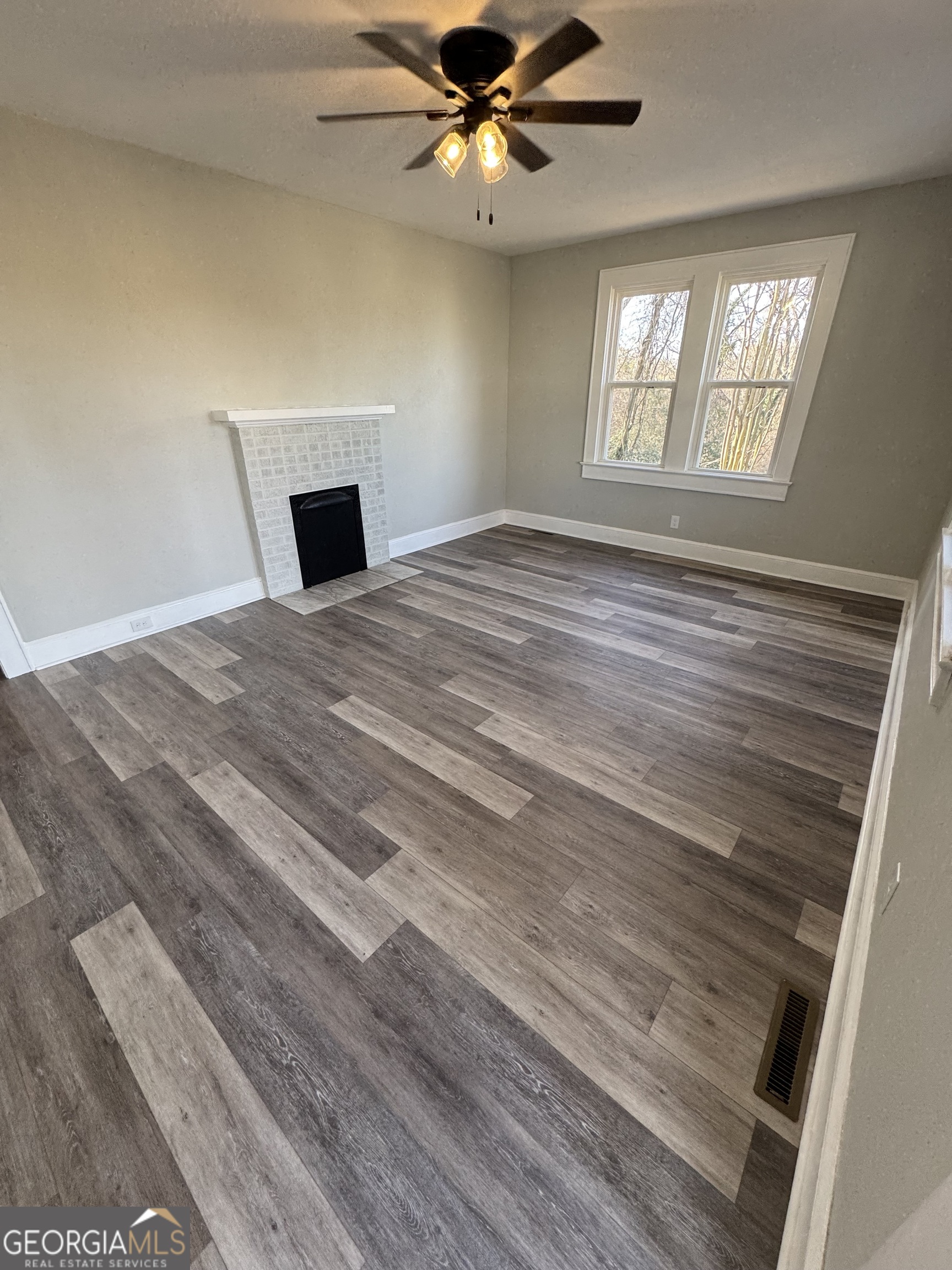 37 West Church Street Elberton, GA 30635 - Photo 10 of 37 a bedroom with a bed and a window