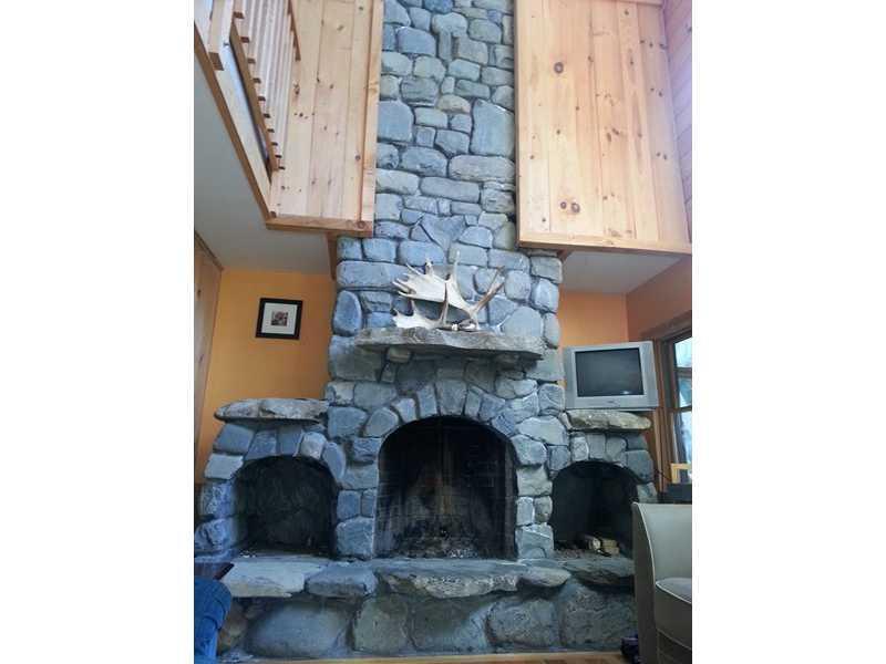 54 Grapevine Brook Road Dover-Foxcroft, ME 04426 - Photo 14 of 30 Living Room. Floor to ceiling...