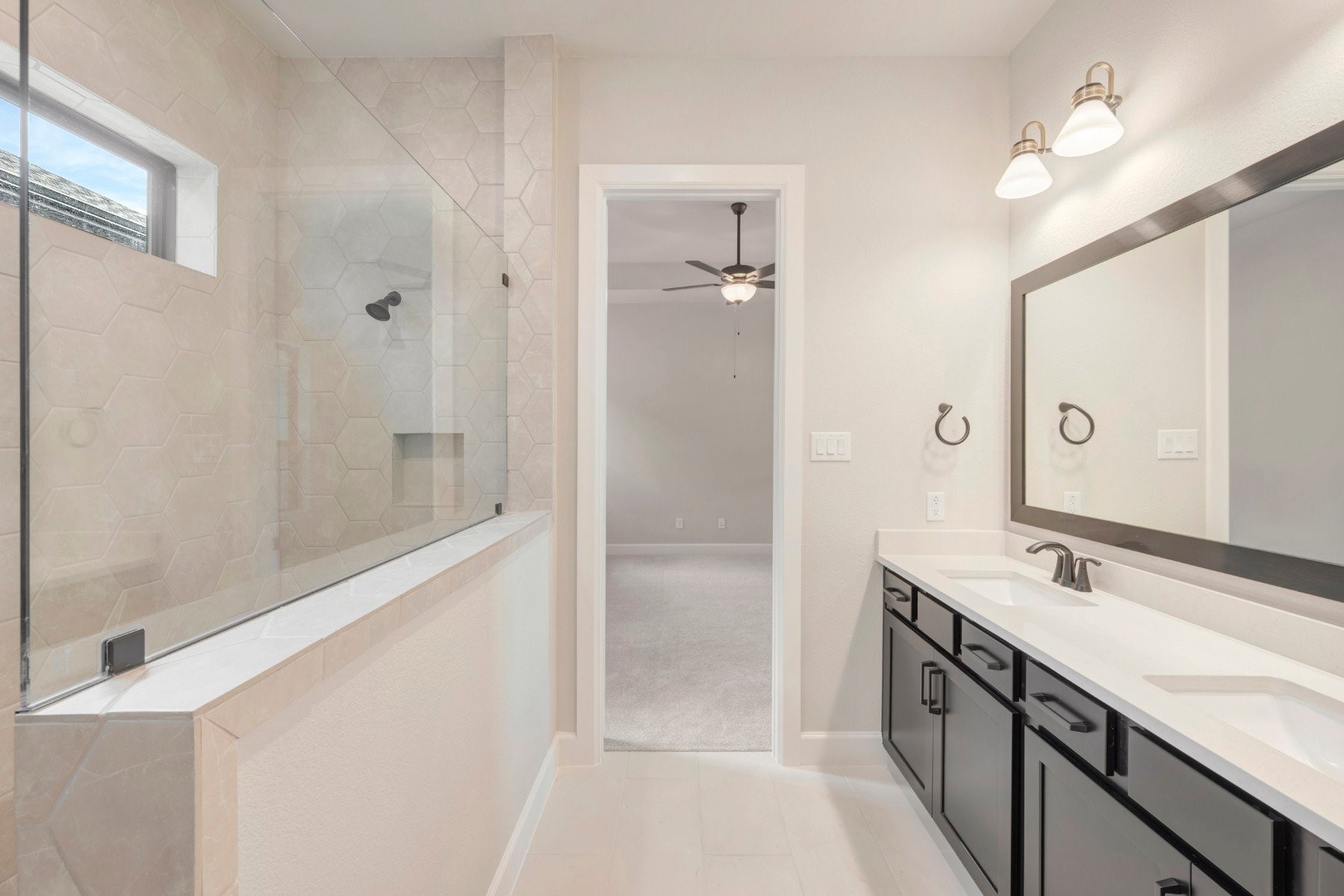 2722 Cottage Place Rosharon, TX 77583 - Photo 41 of 50 a bathroom with a double vanity sink a mirror and a shower