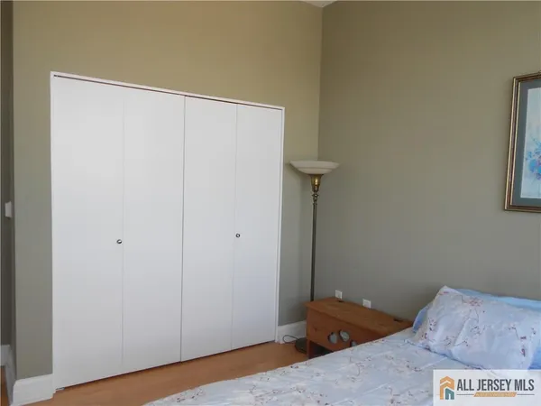 a bedroom with a bed and a gate