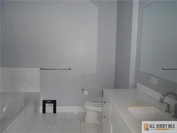 a bathroom with a toilet and a sink