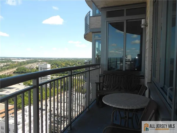 a view of a balcony with chair and table